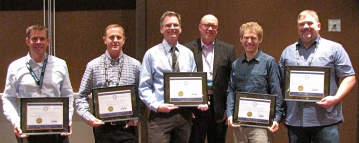 Commons team accepting award from Dan Ross