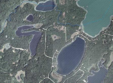 Aerial photo of lakes with GIS polygon overlays